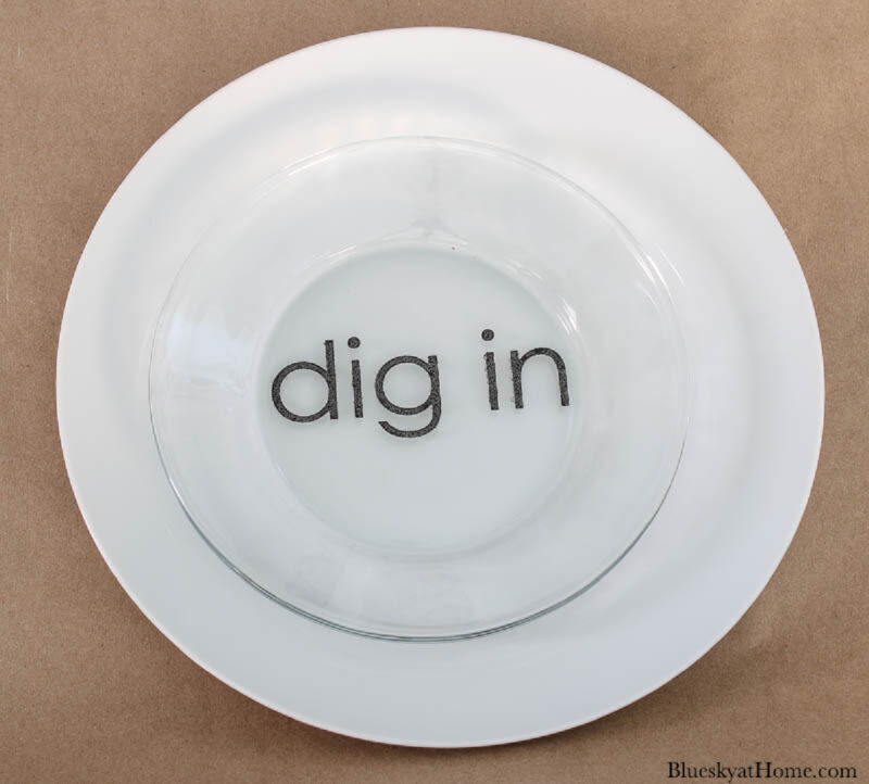 word dig in stencil on glass plate with ceramic paint