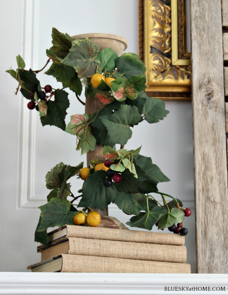 fall vinves around wood candlestick