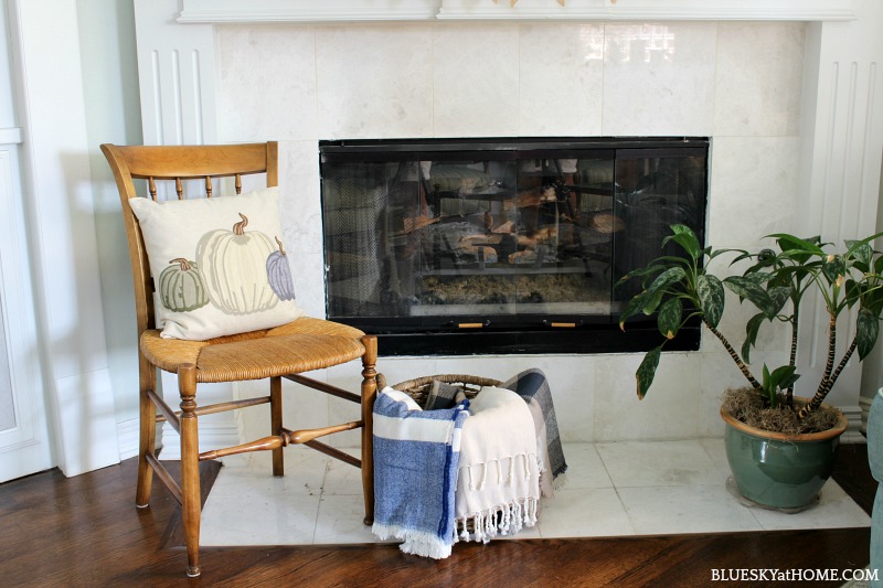 blankets in basket for early fall mantel