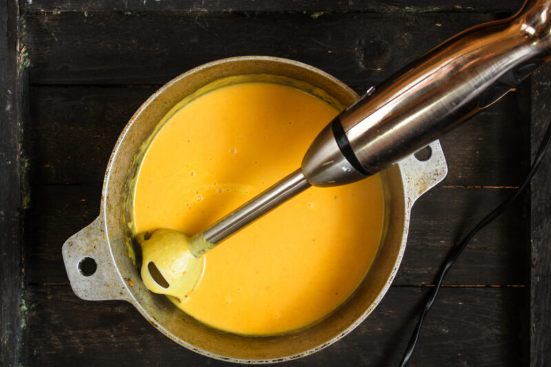 pureeing butternut squash soup with immersion blender