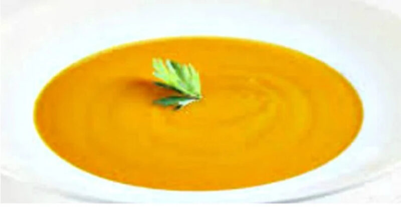 Butternut Squash Soup with Cumin is a perfect first course or as the star of the meal. Comforting and filling, this delicious soup gets a kick from cumin. butternut squash soup with basil leaf in white bowl