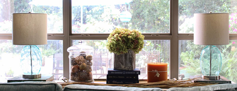 dried hydrangeas in grain scoop on fall decorated table