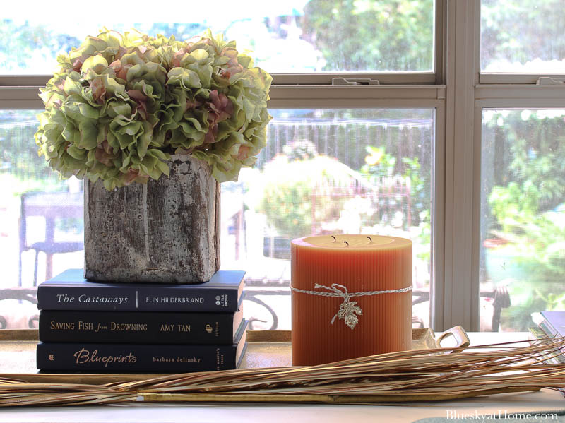 dried hydrangeas in grain scoop on fall decorated table