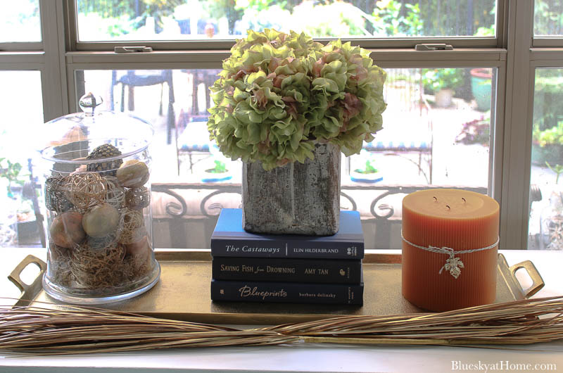 dried hydrangeas in grain scoop on fall decorated table