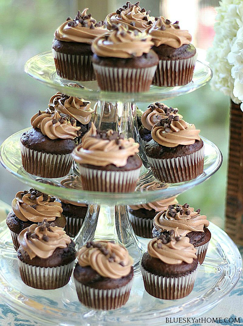 chocolate pumpkin cupcakes on a tiered cake stand