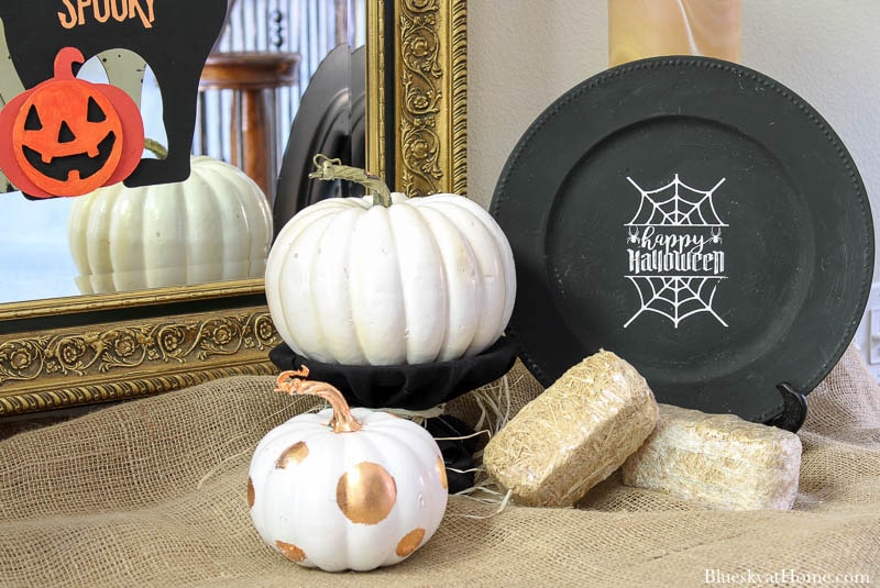  Halloween Decorations for Your Entry with black charger and white pumpkin