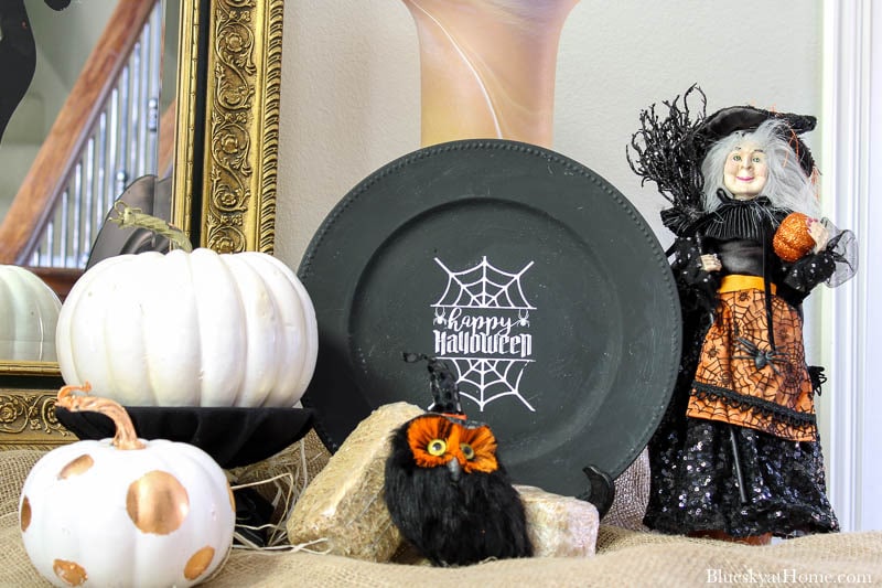 Halloween Decorations for Your Entry with black charger and white pumpkin and witch