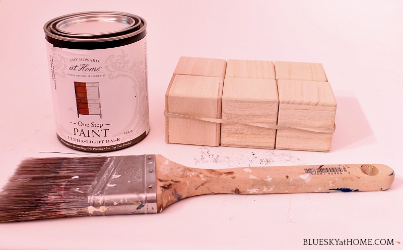 wood blocks, paint can and paint brush