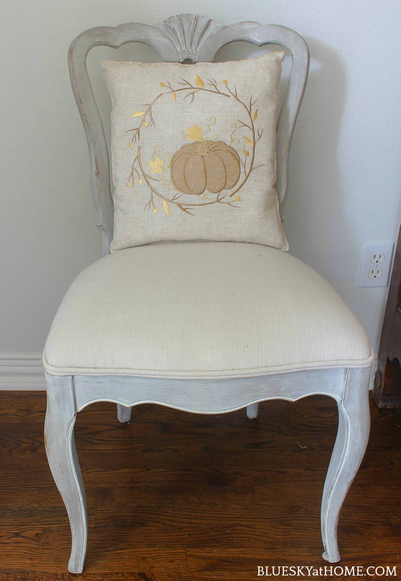  pumpkin pillow on chair