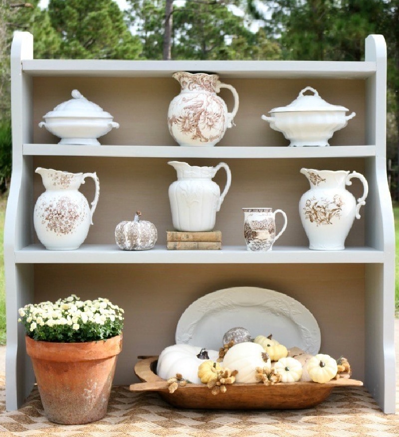 painted hutch with white dishes