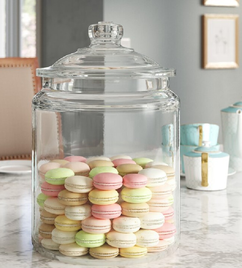 larage apothecary jar filled with pastel cookies