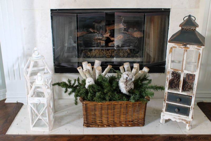 wood box with greenery and white logs