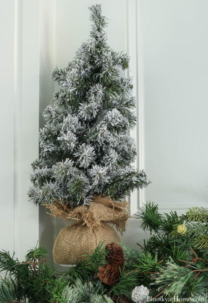 frosted tree on winter mantel