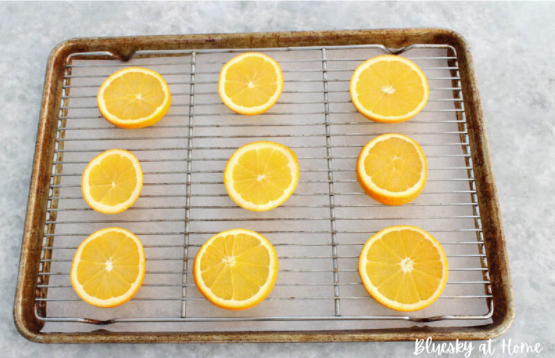 sliced oranges on baking pan