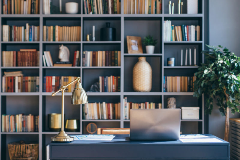 home office with blue bookshelves