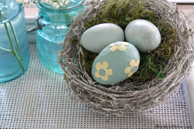 blue Easter eggs in nest