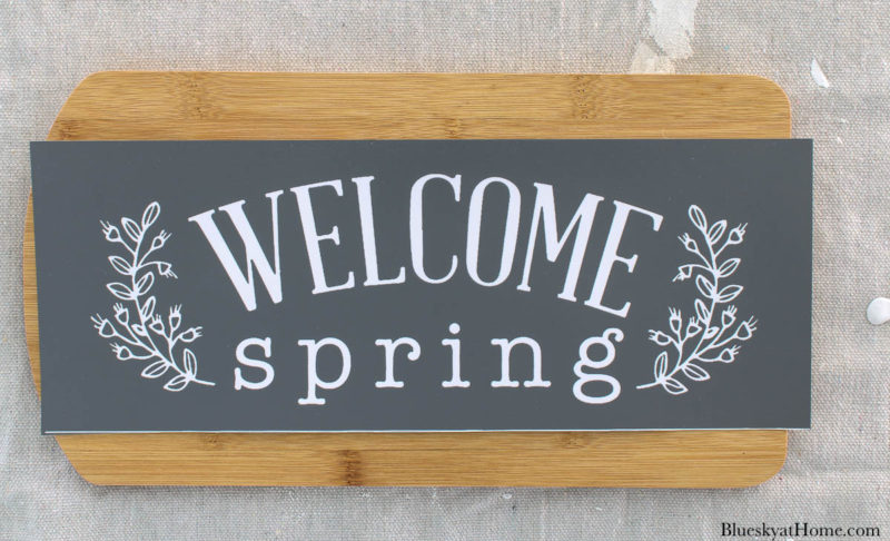 stencil DIY spring home decor on wood cutting board