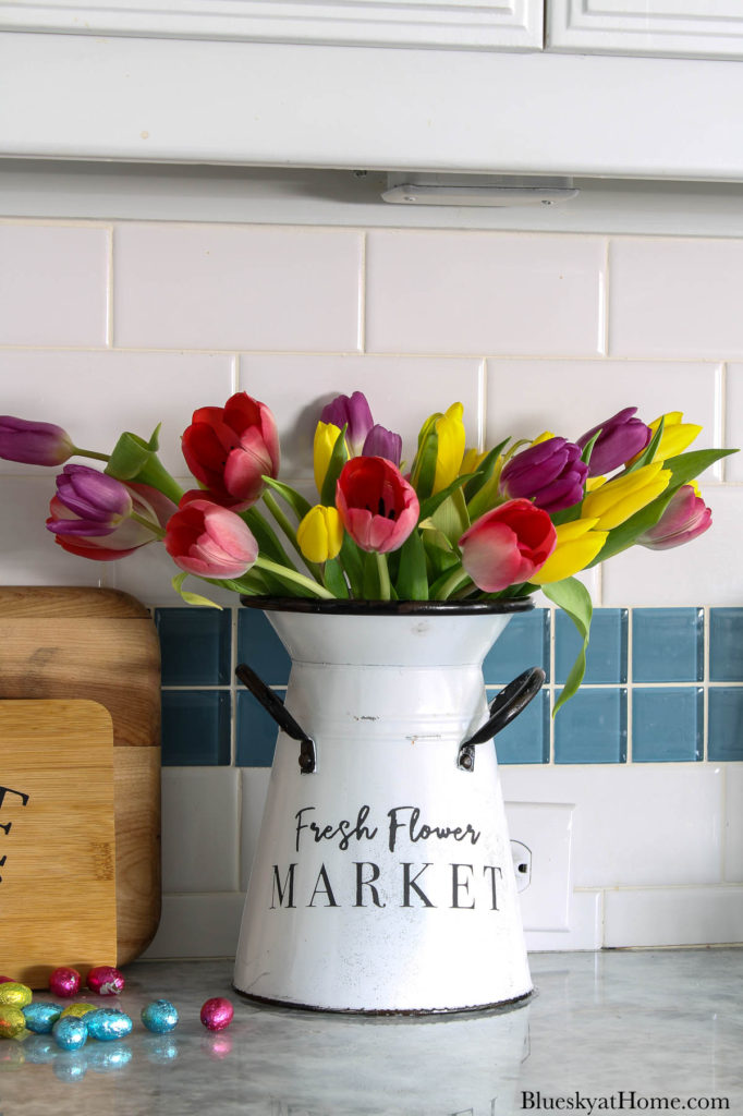 container with spring tulips