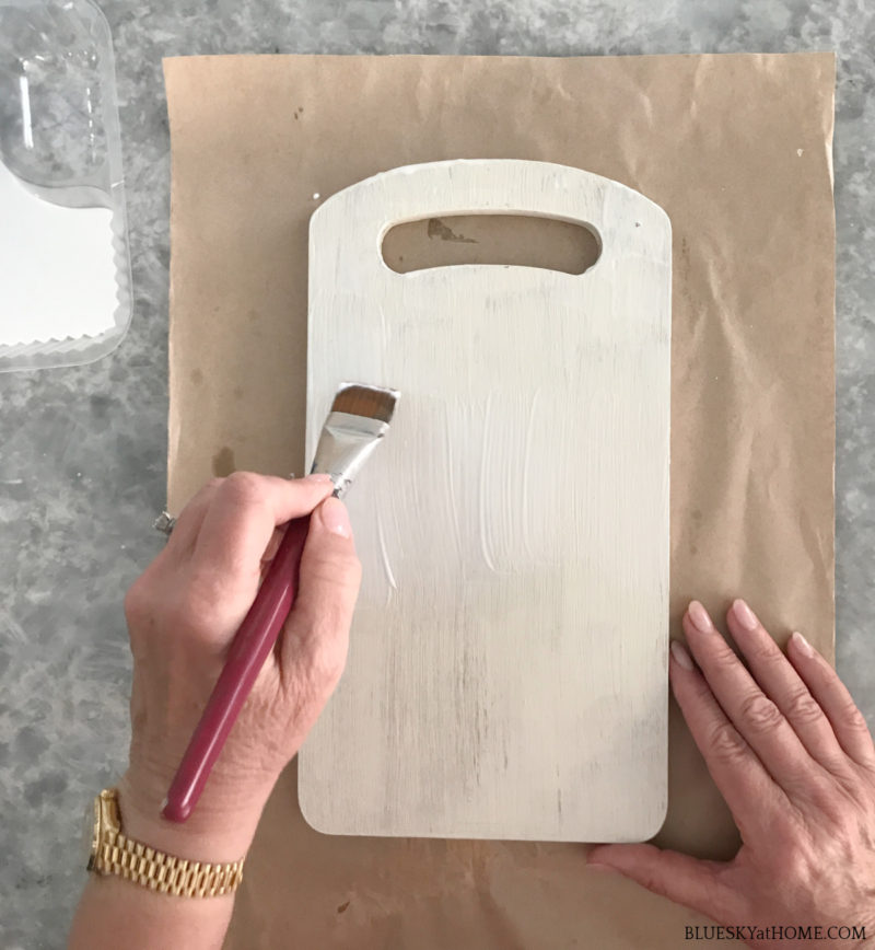 applying Mod Podge to cutting board