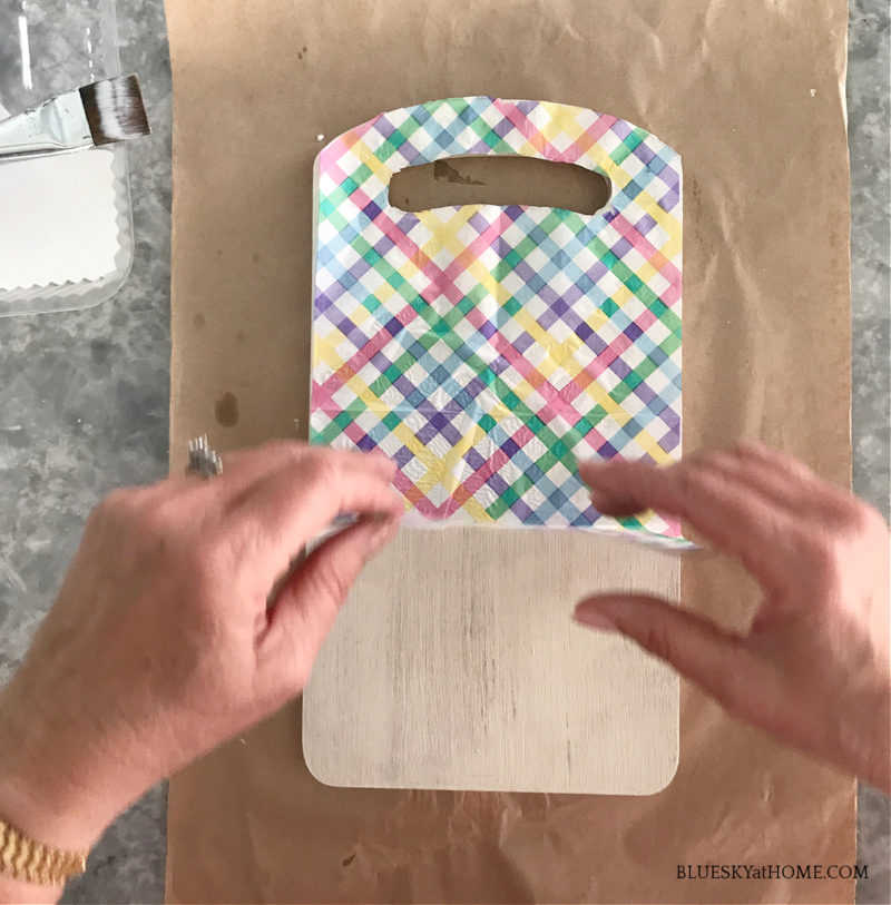 adding napkin to cutting board