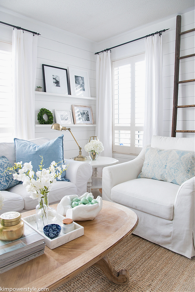 white sofas with blue pillows