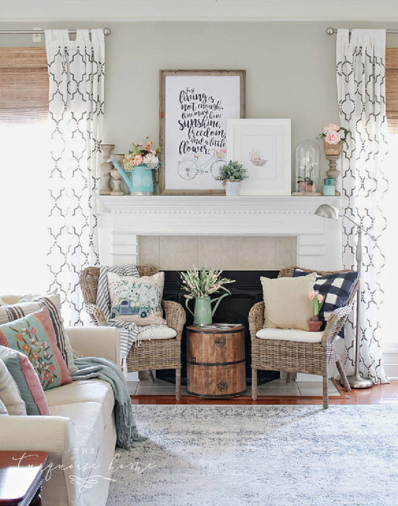 living room with sofa and two chairs in front of fireplace