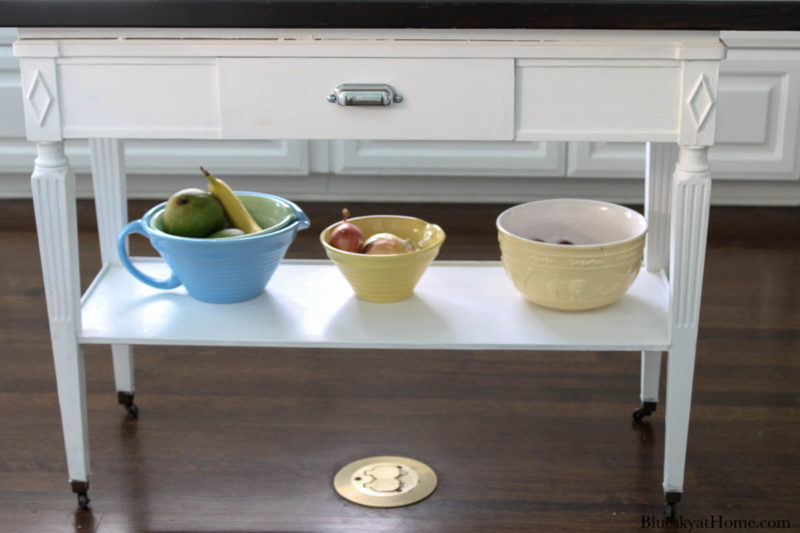 lower shelf with yellow and blue bowls