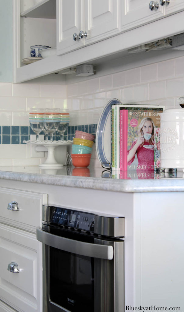 counter with books and bowls and glasses