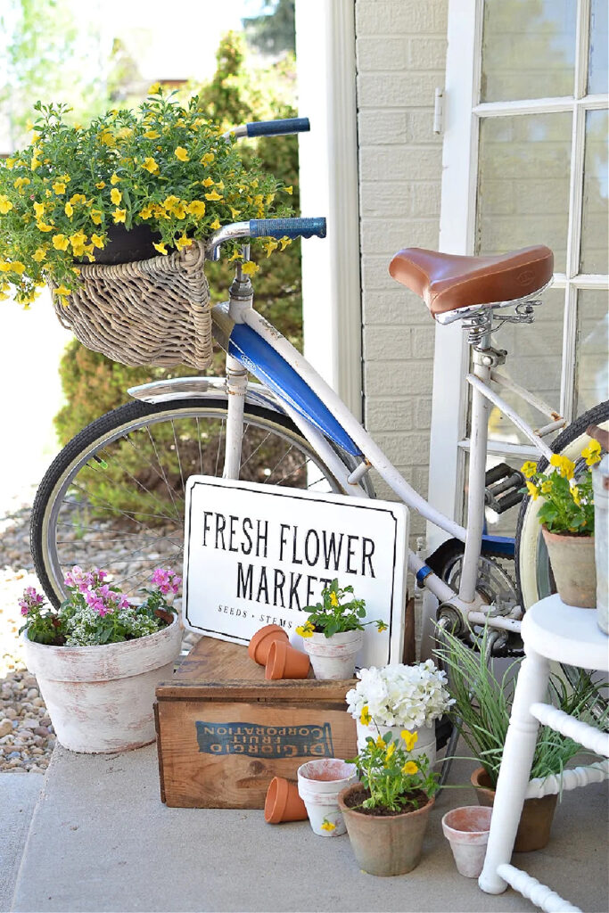 vintage front porch with bicycle and sign