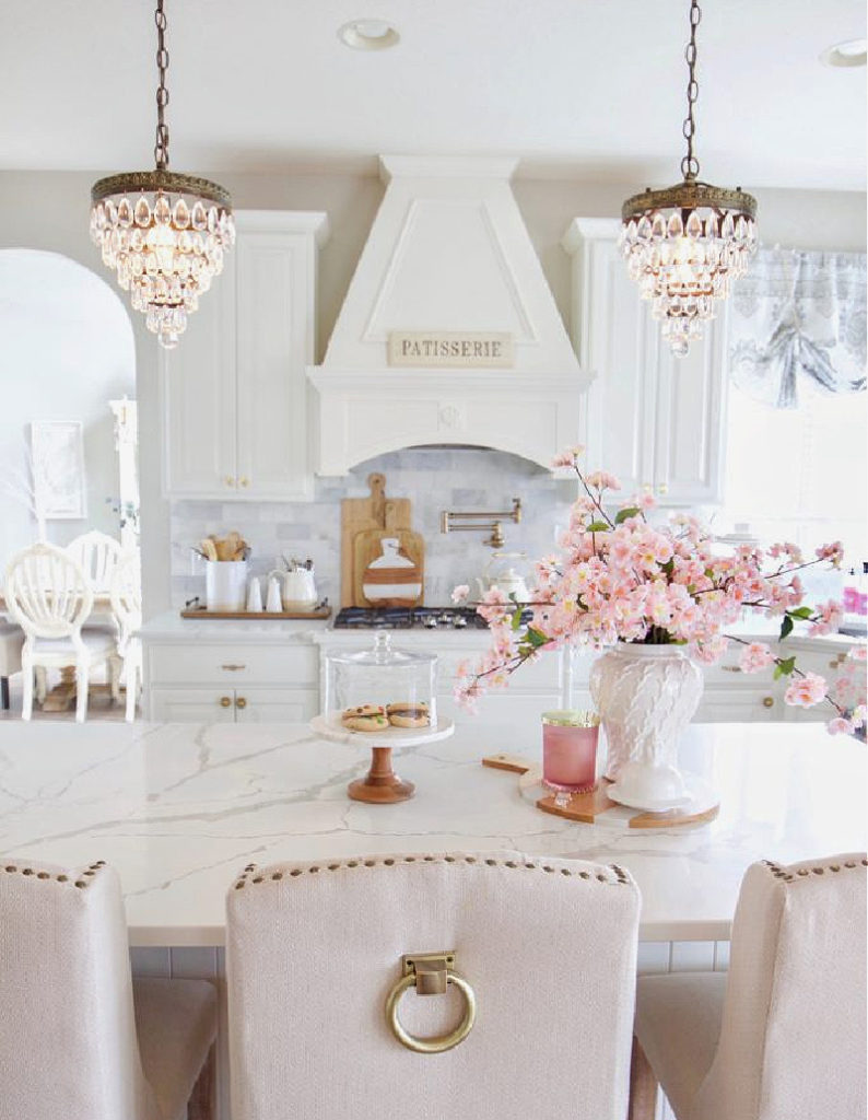 kitchen with chandeliers and pink flowers