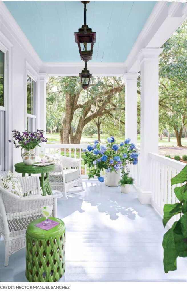 front porch with blue ceiling and blue hydrangeas