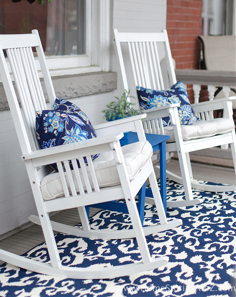 white rocking chairs on blue rug