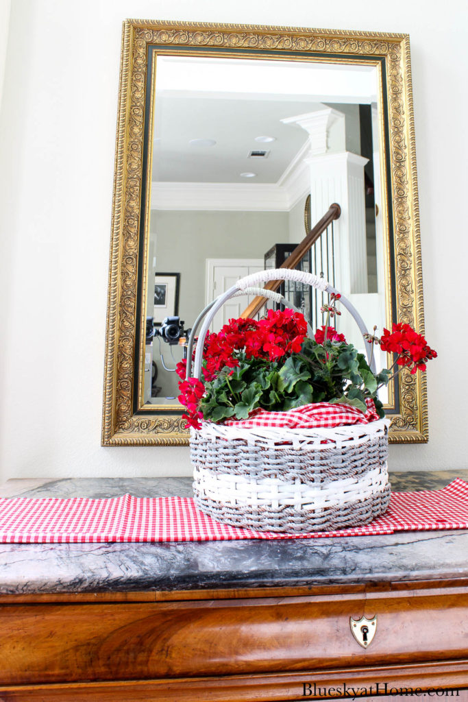 decorated basket with red flowers and American flags