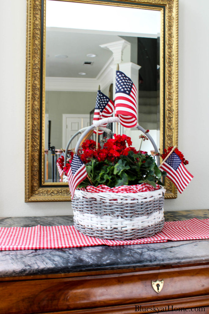 decorated basket with red flowers and American flags