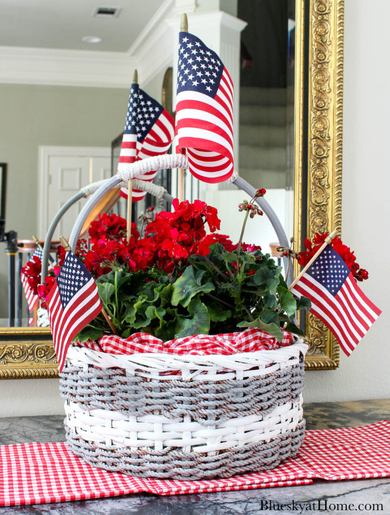 decorated basket with red flowers and American flags