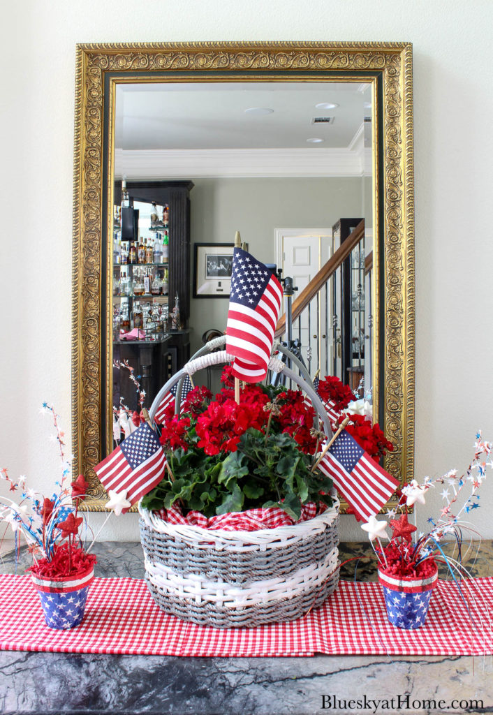 decorated basket with red flowers and American flags