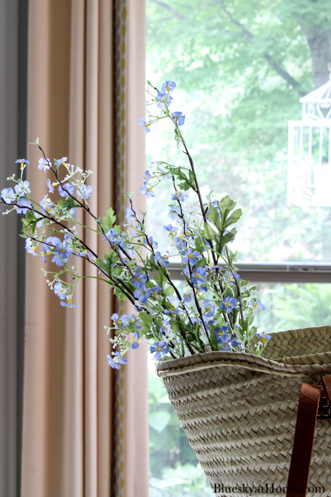 decorated basket with blue flowers