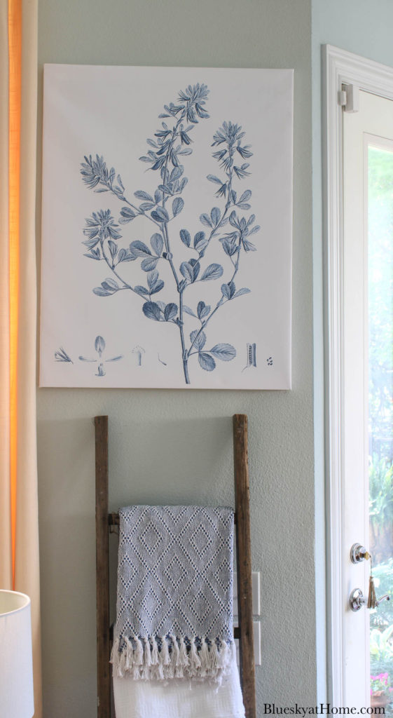 blue botanical canvas print on wall