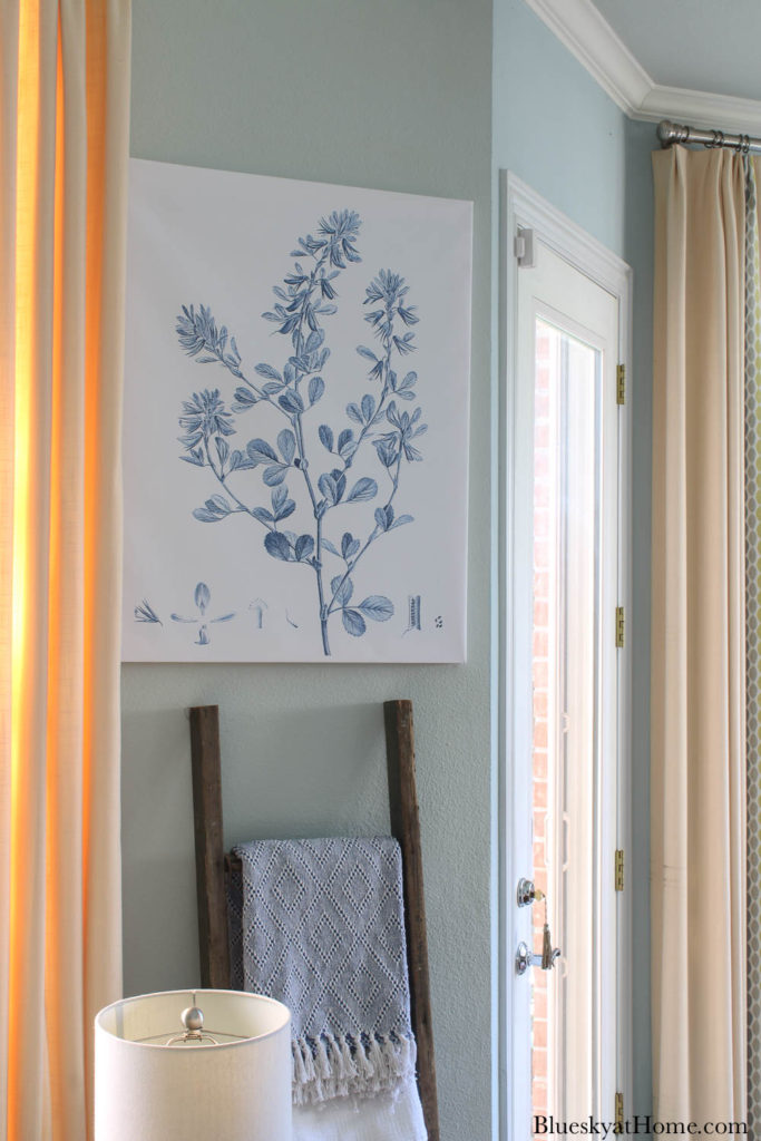 blue botanical canvas print on wall