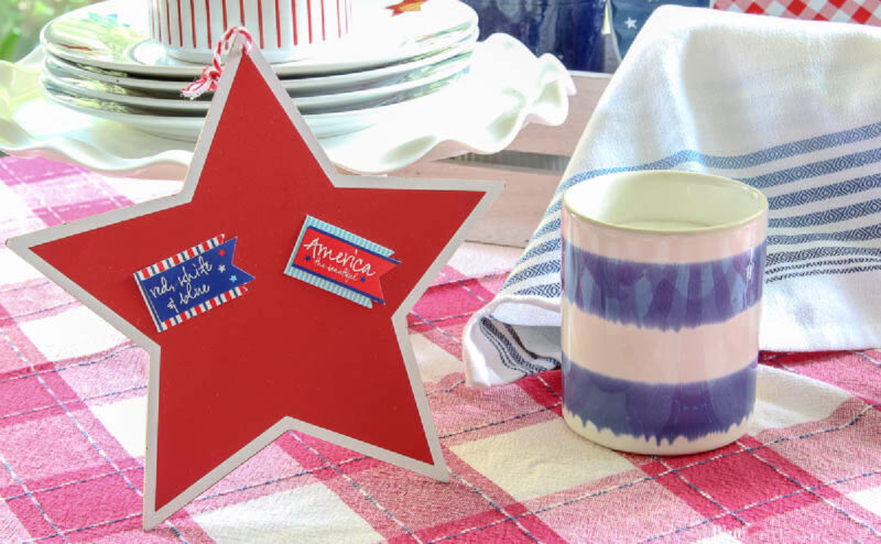 patriotic table vignette with large red star and blue and white stripe candle