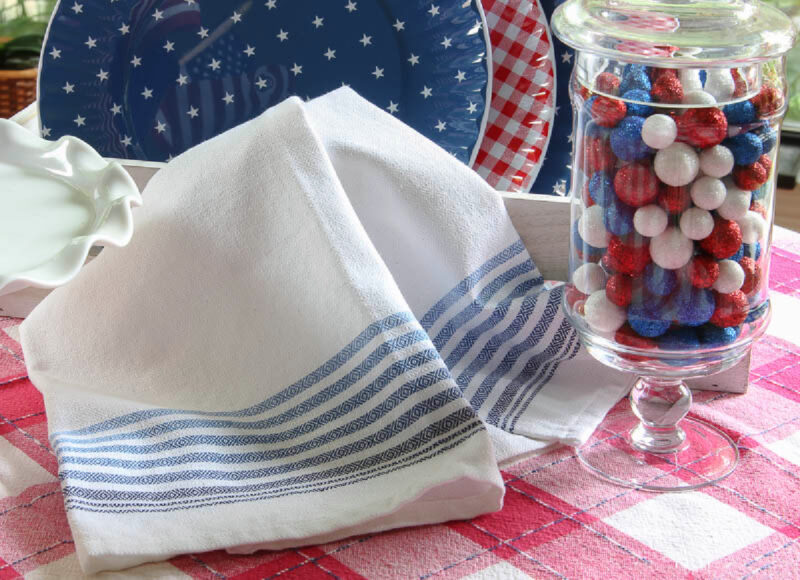 blue and white dish towel on patriotic table vignette