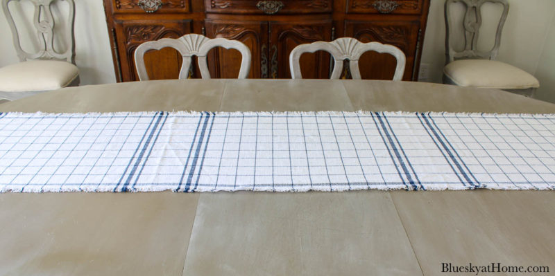 blue and white check runner on table