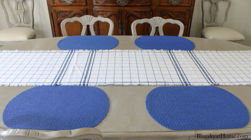 blue and white check runner on table with blue placemats