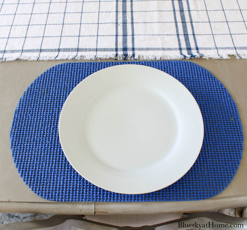 white plate on blue placemat