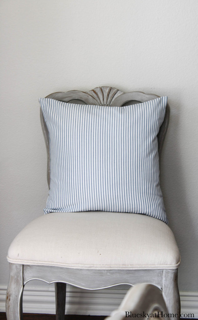 blue and white stripe pillow on chair