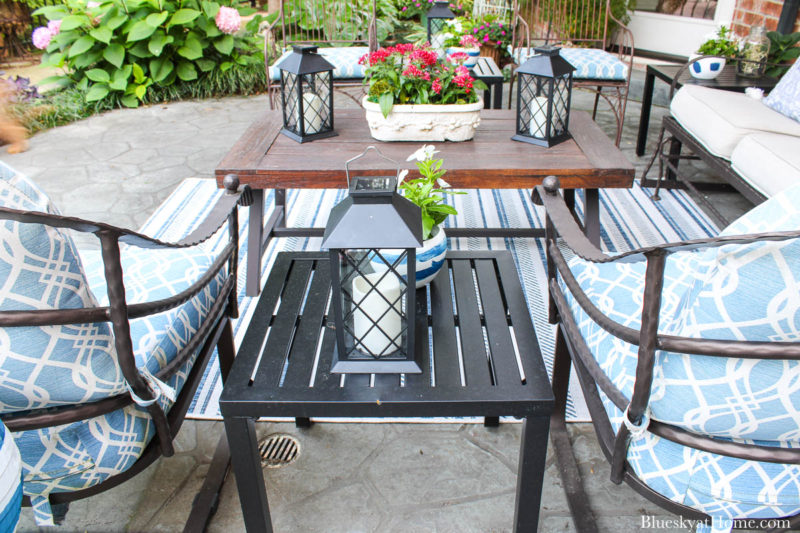 patio black table with lantern in seating area