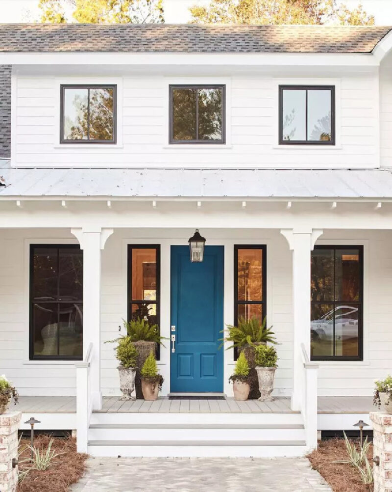 bright blue front door on white house