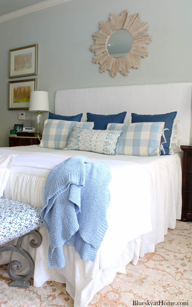 bedroom with fabric-covered headboard
