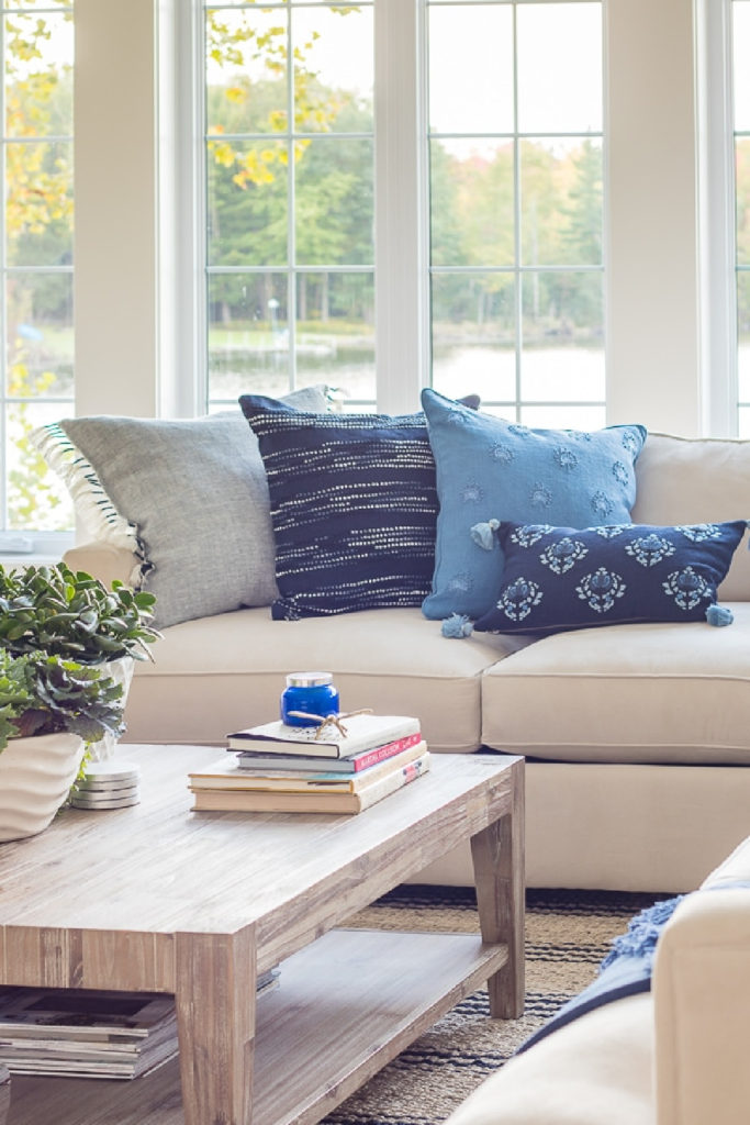 blue pillows on white sofa