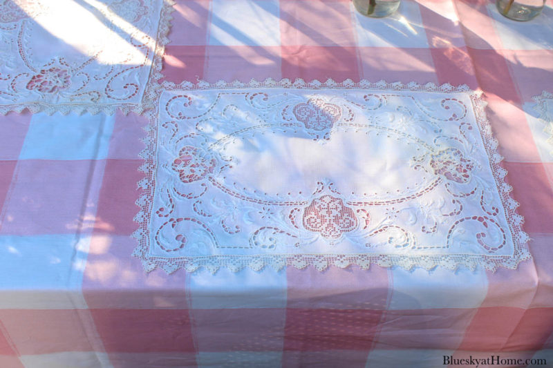 pink and white table cloth with white placemat